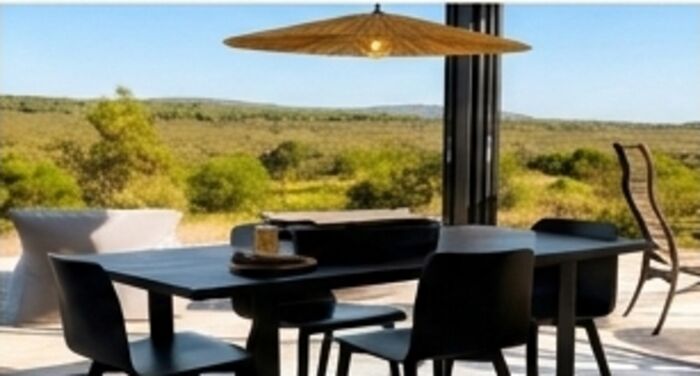 Outdoor dining table under a straw umbrella